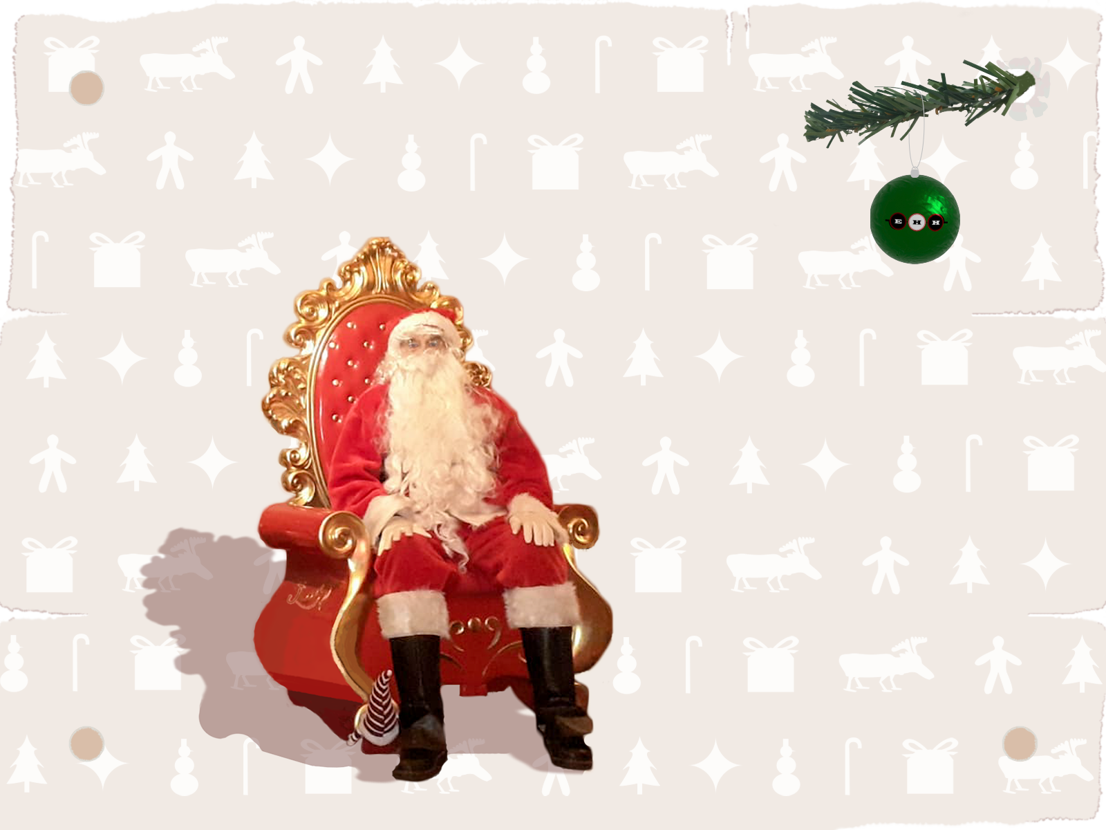 Santa Claus sitting in his arm chair with logo.
